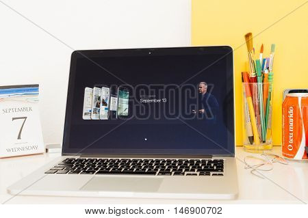 PARIS FRANCE - SEP 8 2016: Apple Computers website on MacBook Retina in room environment showcasing live coverage of Apple Keynote - ios10 availability