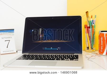PARIS FRANCE - SEP 8 2016: Apple Computers website on MacBook Retina in room environment showcasing live coverage of Apple Keynote - Sia performing at the end of Keynote