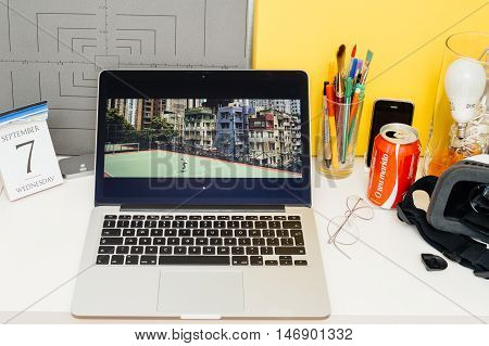 PARIS FRANCE - SEP 8 2016: Apple Computers website on MacBook Retina in room environment showcasing live coverage of Apple Keynote - presentation of iPhone new photo camera double camera