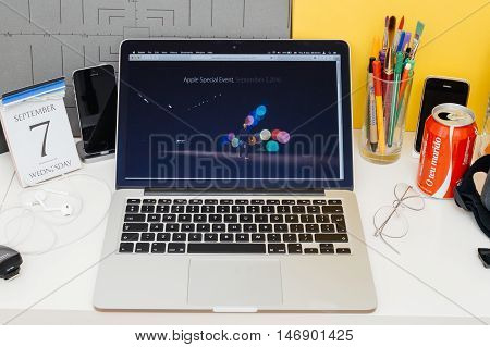 PARIS FRANCE - SEP 8 2016: Apple Computers website on MacBook Retina in room environment showcasing live coverage of Apple Keynote - Tim Cooke welcoming guests startig keynote