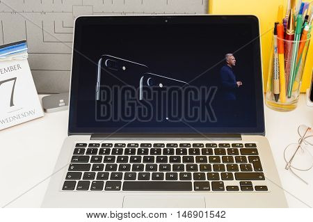 PARIS FRANCE - SEP 8 2016: Apple Computers website on MacBook Retina in room environment showcasing live coverage of Apple Keynote - presentation of iPhone new photo camera double camera
