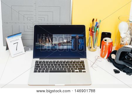 PARIS FRANCE - SEP 8 2016: Apple Computers website on MacBook Retina in room environment showcasing live coverage of Apple Keynote - presentation of iPhone new photo camera double camera