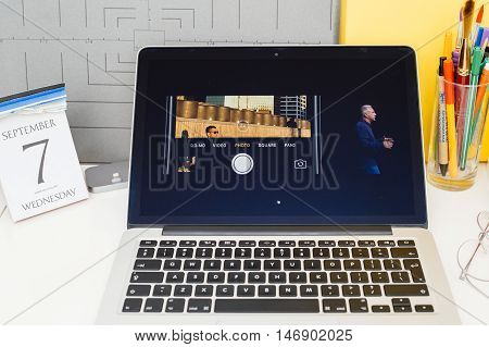 PARIS FRANCE - SEP 8 2016: Apple Computers website on MacBook Retina in room environment showcasing live coverage of Apple Keynote - presentation of iPhone new photo camera double camera
