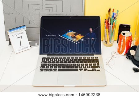 PARIS FRANCE - SEP 8 2016: Apple Computers website on MacBook Retina in room environment showcasing live coverage of Apple Keynote - presentation of iPhone new photo camera double camera