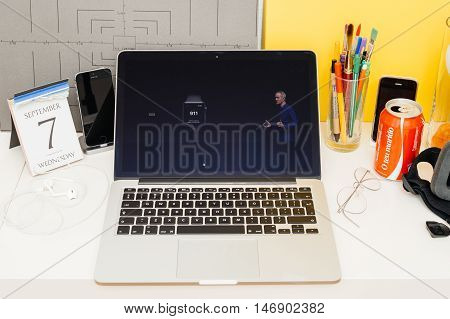 PARIS FRANCE - SEP 8 2016: Apple Computers website on MacBook Retina in room environment showcasing live coverage of Apple Keynote - Apple COO Jeff Williams about new Apple Watch sos 911 app