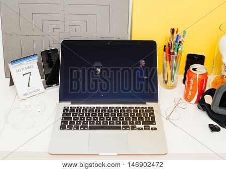 PARIS FRANCE - SEP 8 2016: Apple Computers website on MacBook Retina in room environment showcasing live coverage of Apple Keynote - Apple COO Jeff Williams about new Apple Watch faces
