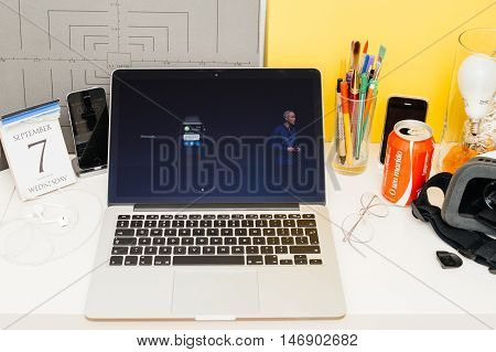 PARIS FRANCE - SEP 8 2016: Apple Computers website on MacBook Retina in room environment showcasing live coverage of Apple Keynote - Apple COO Jeff Williams about new Apple Watch and messages app