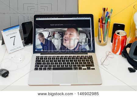 PARIS FRANCE - SEP 8 2016: Apple Computers website on MacBook Retina in room environment showcasing live coverage of Apple Keynote - CEO Tim Cook singing with James Corden in a Carpool Karaoke type video