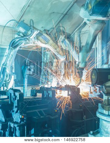 Welding robots movement in a car factory