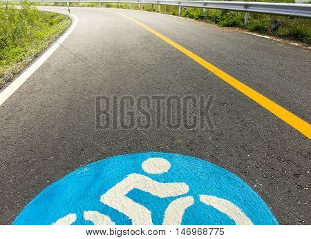 Bike lanes. Bike lane in suburb area with bike lane icon indicated. Bike lane sign on asphalt road.