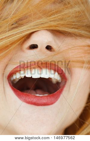 Happy laughing woman with red hair close-up. portrait of unrecognizable carroty girl with wide perfect smile. Fun, gladness, joy concept