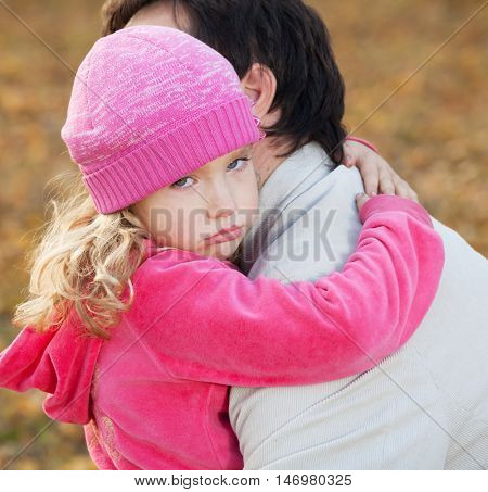 Dad pitying daughter. Sad child with father