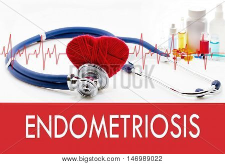 Medical concept endometriosis. Stethoscope and red heart on a white background