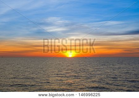 Sunset at sea with beautiful clouds in the evening and twilight time