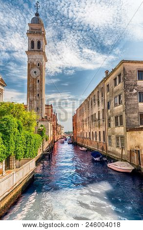 Venice, Italy - April 29:  Scenic Architecture Along The Canal Rio Dei Greci And The Leaning Bell To