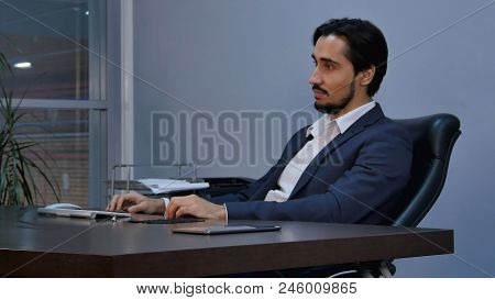 Portrait Of Latin Businessman Sitting And Listening Carefully. Professional Shot