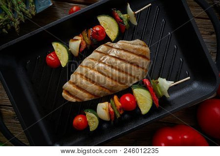 grilled chicken breast with brochette vegetable on grill pan