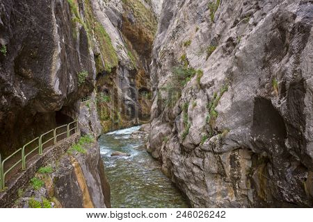 Entrance of the hiking trail Ruta del Cares along river Cares in Cain, Picos de Europa National Park, Leon, Spain. 