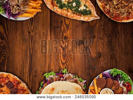 Top down view on traditional turkish meals on vintage wooden table. Close-up.