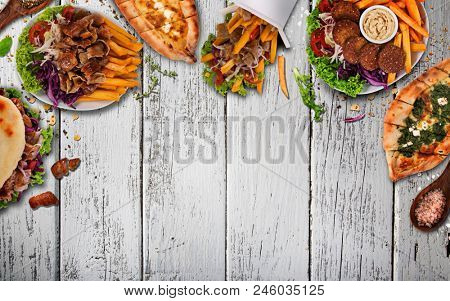 Top down view on traditional turkish meals on vintage wooden table. Close-up.