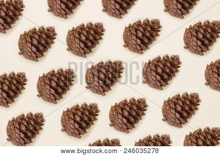 Pine Cones Pattern On Beige Paper Background