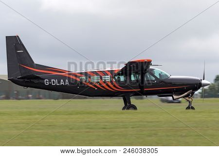 Raf Waddington, Lincolnshire, Uk - July 5, 2014: Cessna 208 Caravan G-dlaa On The Runway After Landi