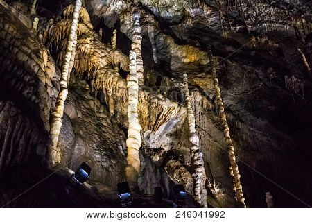 Illuminated Multicolored Stalactites In Cave Han-sur-lesse In Belgium