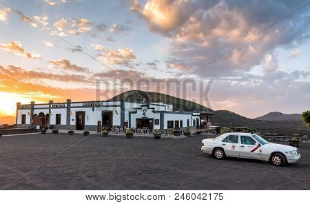 Lanzarote, Spain - December 27, 2016: Local Wineshop Called Bodega And Taxi With Volcanic Landscape 