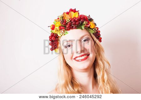Art Creative Portrait Of Blonde Woman In Autumnal Wreath. Conceptr Of Mother Earth