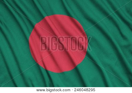 Bangladesh Flag  Is Depicted On A Sports Cloth Fabric With Many Folds. Sport Team Waving Banner