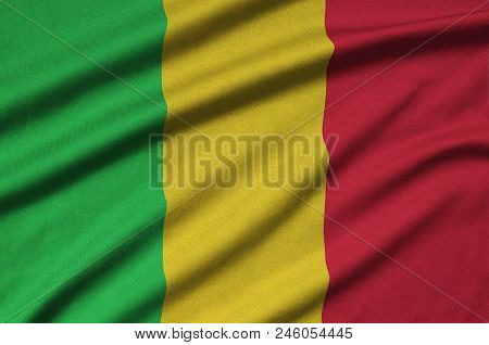 Mali Flag  Is Depicted On A Sports Cloth Fabric With Many Folds. Sport Team Waving Banner