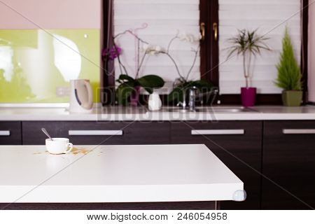 Kitchen Interior With Spilled Coffee On The White Tabletop