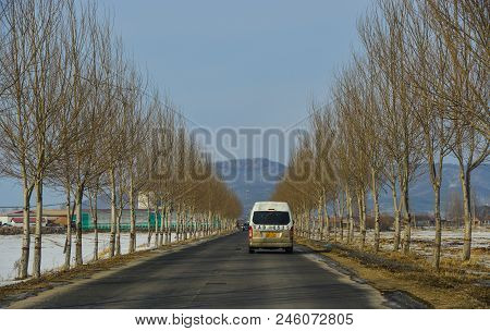 Harbin, China - Feb 24, 2018. Cars Running On Mountain Road At Winter In Harbin, China.