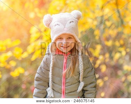little girl in an autumn forest