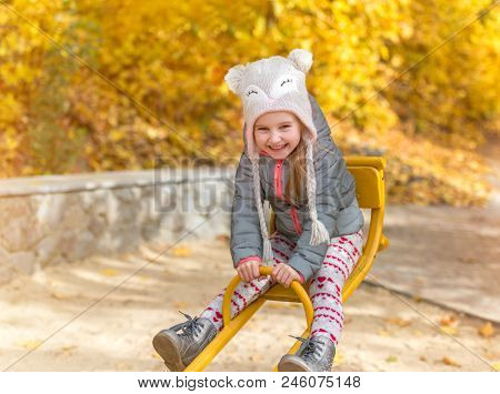 little girl in an autumn forest