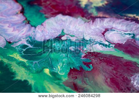 Abstraction Of The Flowing Multi-colored Acrylic Paints