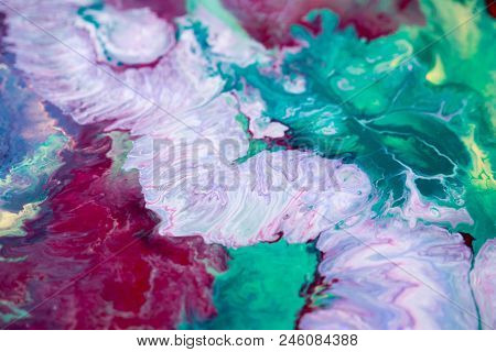 Abstraction Of The Flowing Multi-colored Acrylic Paints