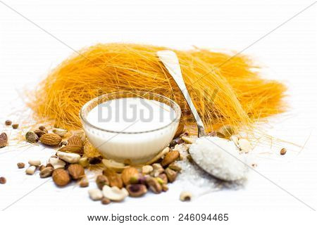 Close Up Of Raw Vermicelli Or Sevee Or Seviyan Or Seviyaan And Dry Fruits Isolated On White With A B