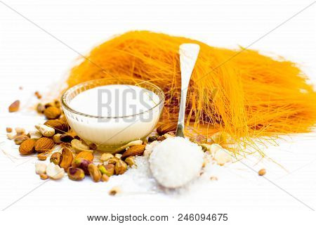 Close Up Of Raw Vermicelli Or Sevee Or Seviyan Or Seviyaan And Dry Fruits Isolated On White With A B