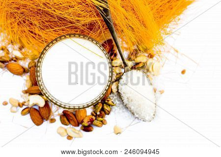 Close Up Of Raw Vermicelli Or Sevee Or Seviyan Or Seviyaan And Dry Fruits Isolated On White With A B