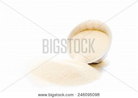 Semolina Flour In A White Colored Bowl Isolated On White Also Known As Sooji Or Suji.