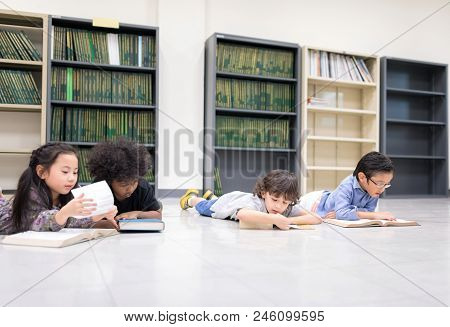 Happy Kids And Bored Kids Reading On The Floor, Education Lifestlye In The Library. Young People Exp