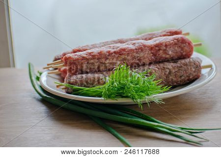 Raw Lulya Kebab From Meat On A White Plate.