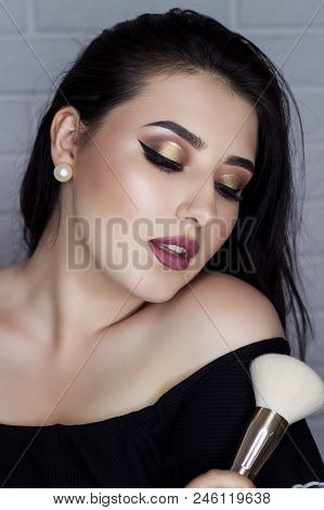 Beautiful Brunette With Makeup Brush