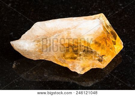 Macro Shooting Of Natural Rock Specimen - Rough Crystal Of Citrine (yellow Quartz) Gemstone On Black
