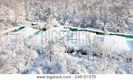 Above View Of Snow-covered Garages Between Urban Timiryazevsky Park And Apple Orchard In Moscow City