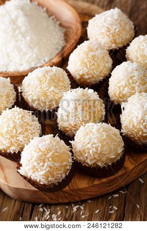 Brazilian Coconut Kisses (beijinhos De Coco) Condensed Milk And Coconut Flakes Close-up. Vertical