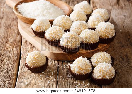 Festive Brazilian Beijinhos De Coco Or Branquinhos Candy Balls With Condensed Milk And Coconut Close
