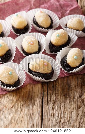 Delicious Brazilian Olho De Sogra Sweets From Condensed Milk, Prunes And Coconut In Sugar Close-up.