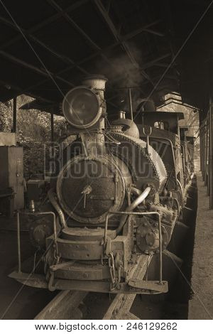 Darjeeling Himalayan Railway or Toy Trainon, famous tourist attraction. Vintage sepia filter applied